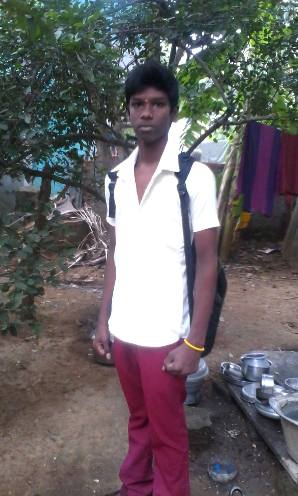 Younger Manoj Chandran standing outdoors