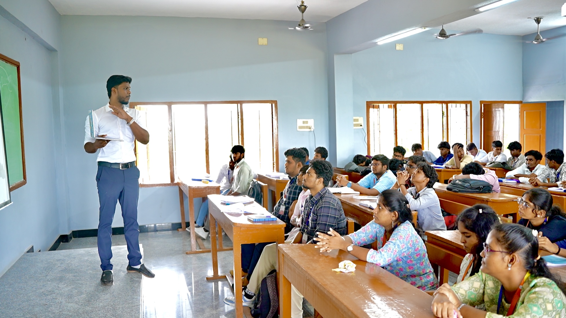 A B2E trainer teaching students in a college classroom